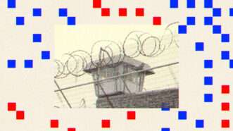 Barbed wire at a prison is seen surrounded by red and blue squares
