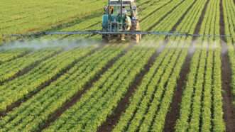 Tractor irrigates a field.