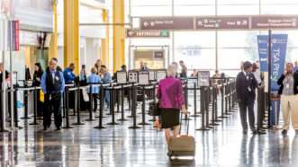 passengers lining up for TSA screening