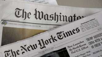 The front pages of The New York Times and The Washington Post newspapers.