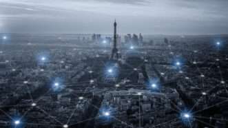 Eiffel Tower amid a cityscape with a network grid overlay
