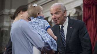 Joe Biden greets a small child