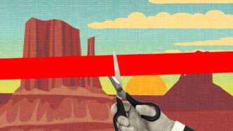 A hand holding scissors cuts red tape over Utah's Monument Valley