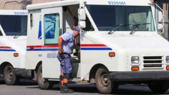 U.S. Postal Service truck and worker